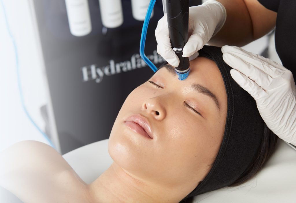 hydrafacial wand on the side of the machine