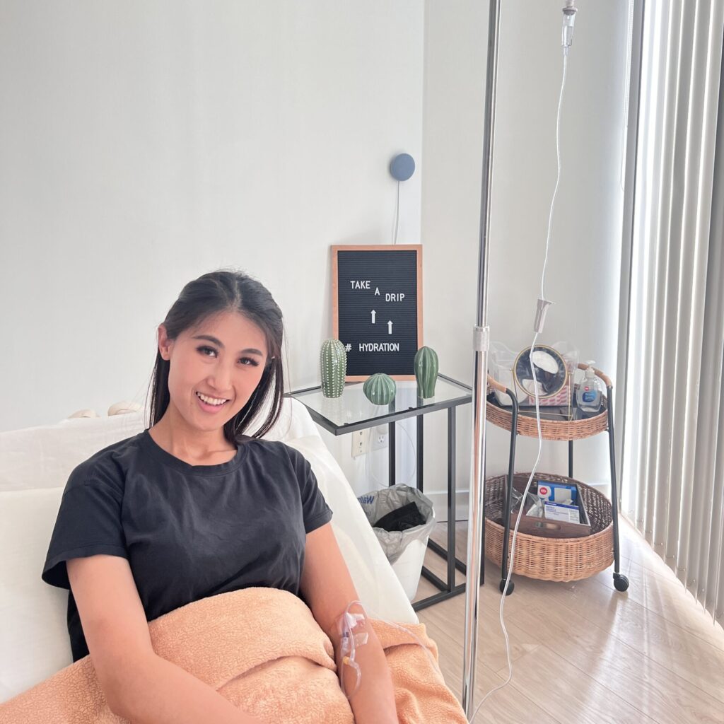 pilates instructor sitting on pilates machine