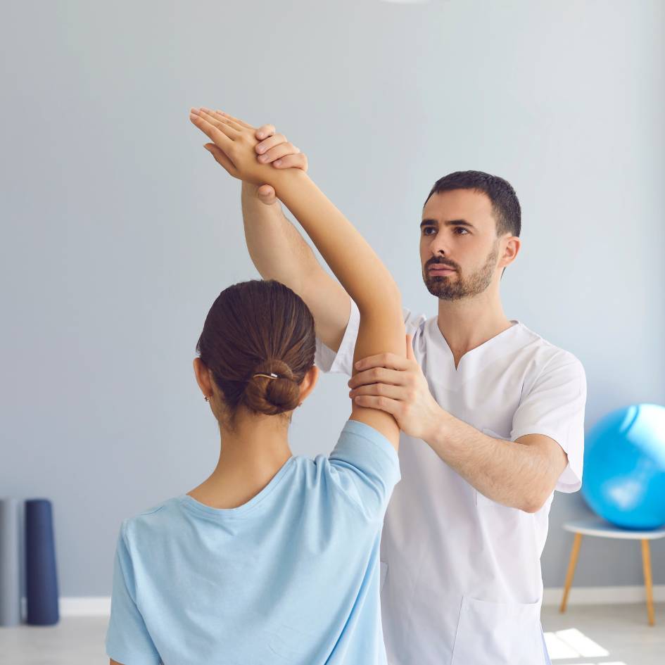 woman doing a front bridge exercise on a pilates machine