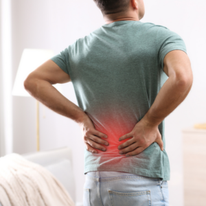 Man holding foot in pain due to plantar fasciitis – seeking RMT treatment in Burnaby for foot and heel relief.