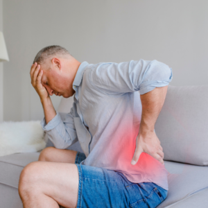 Man holding shoulder in visible pain – suffering from shoulder tension or injury, ideal for RMT treatment in Burnaby.